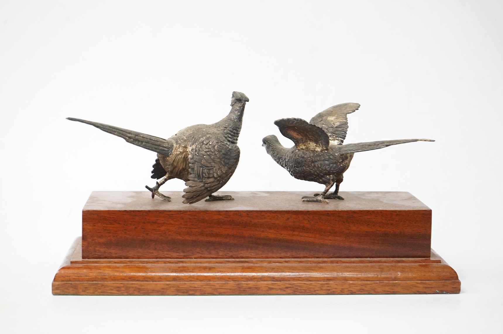 Two modern silver model game birds by Edward Barnard & Sons Ltd, London, 1991/92, mounted on a wooden presentation base with vacant silver plaque, bird height 72mm. Condition - fair to good